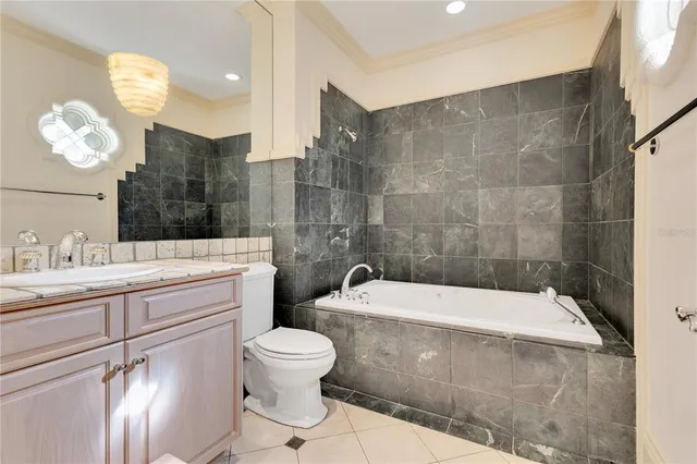 a swimming pool with outdoor seating and yard