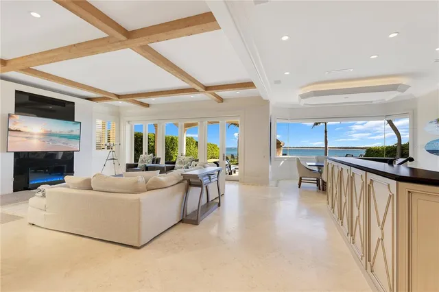 a kitchen with stainless steel appliances kitchen island granite countertop a refrigerator and a sink