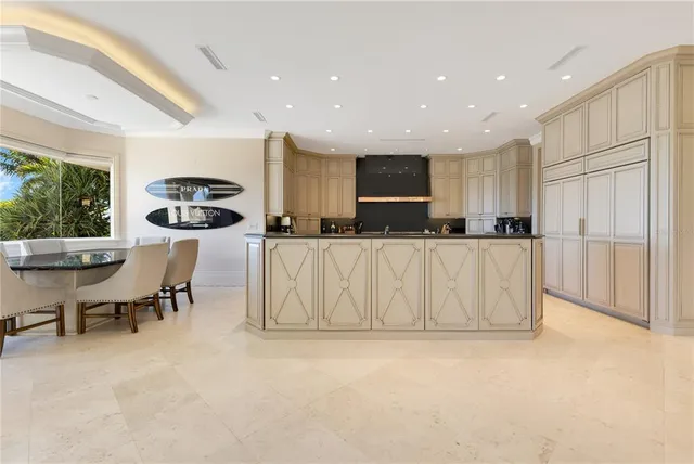 a kitchen with stainless steel appliances granite countertop a sink and a stove