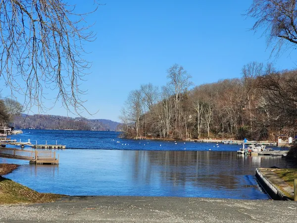 a view of a swimming pool with an outdoor space and seating area