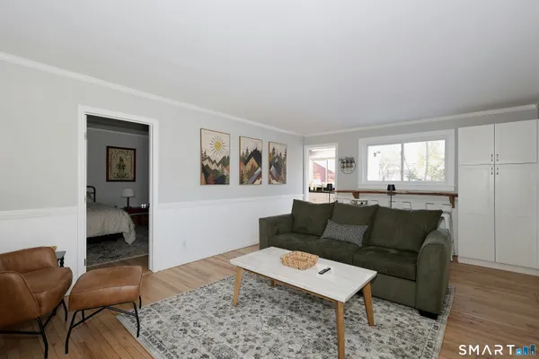 a living room with furniture and a window