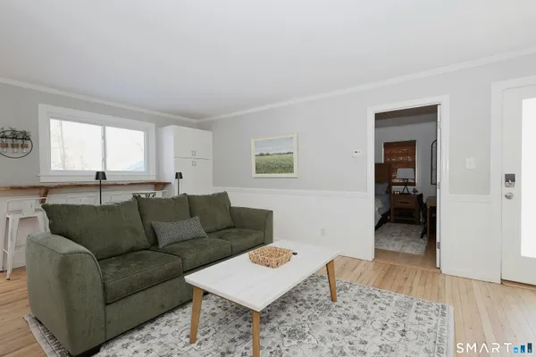 a living room with furniture and a rug
