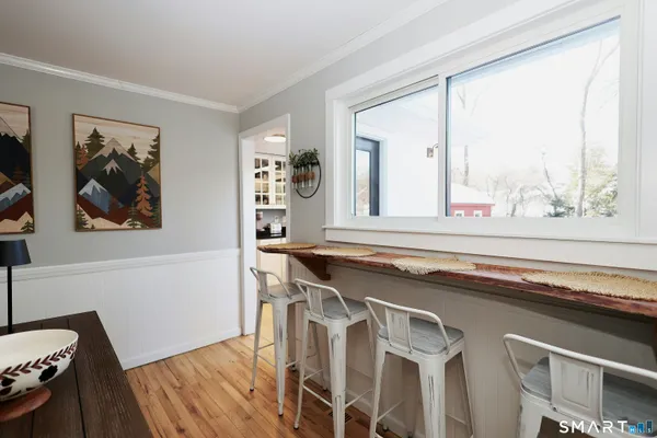 a bathroom with a sink and a window