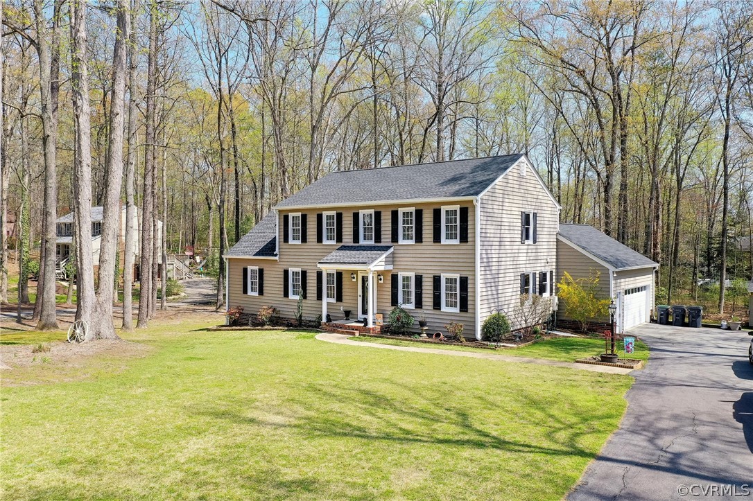 13331 Queensgate Road Midlothian, VA 23114 - Photo 3 of 46 a view of a house with a garden and trees