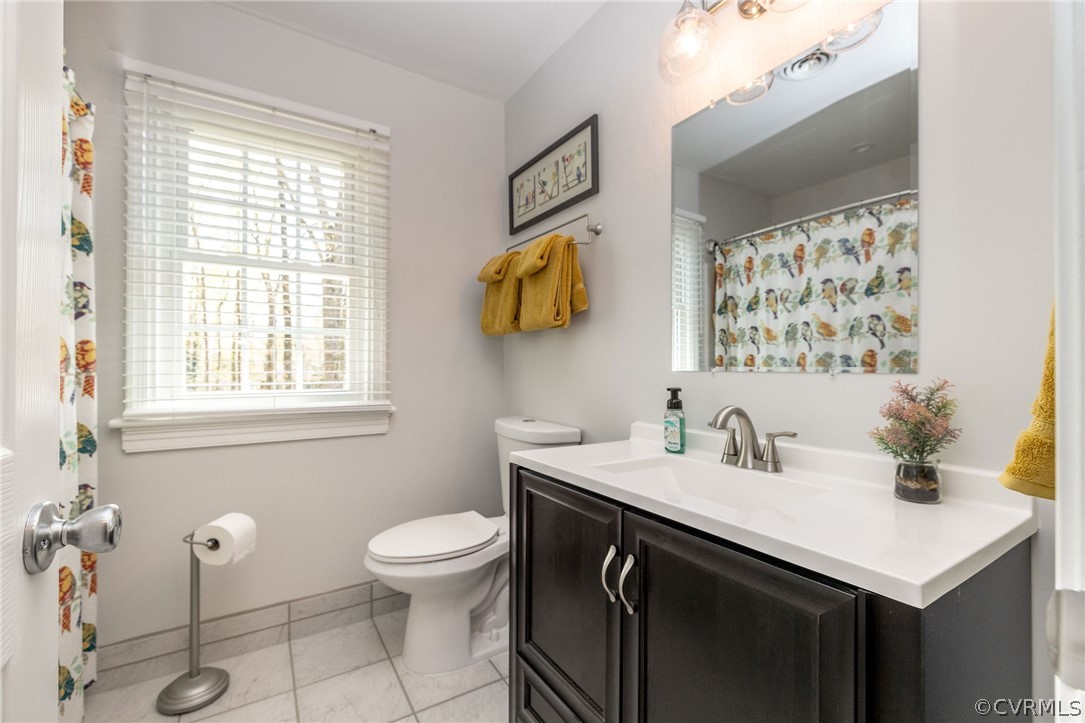 13331 Queensgate Road Midlothian, VA 23114 - Photo 33 of 46 a bathroom with a sink and a toilet