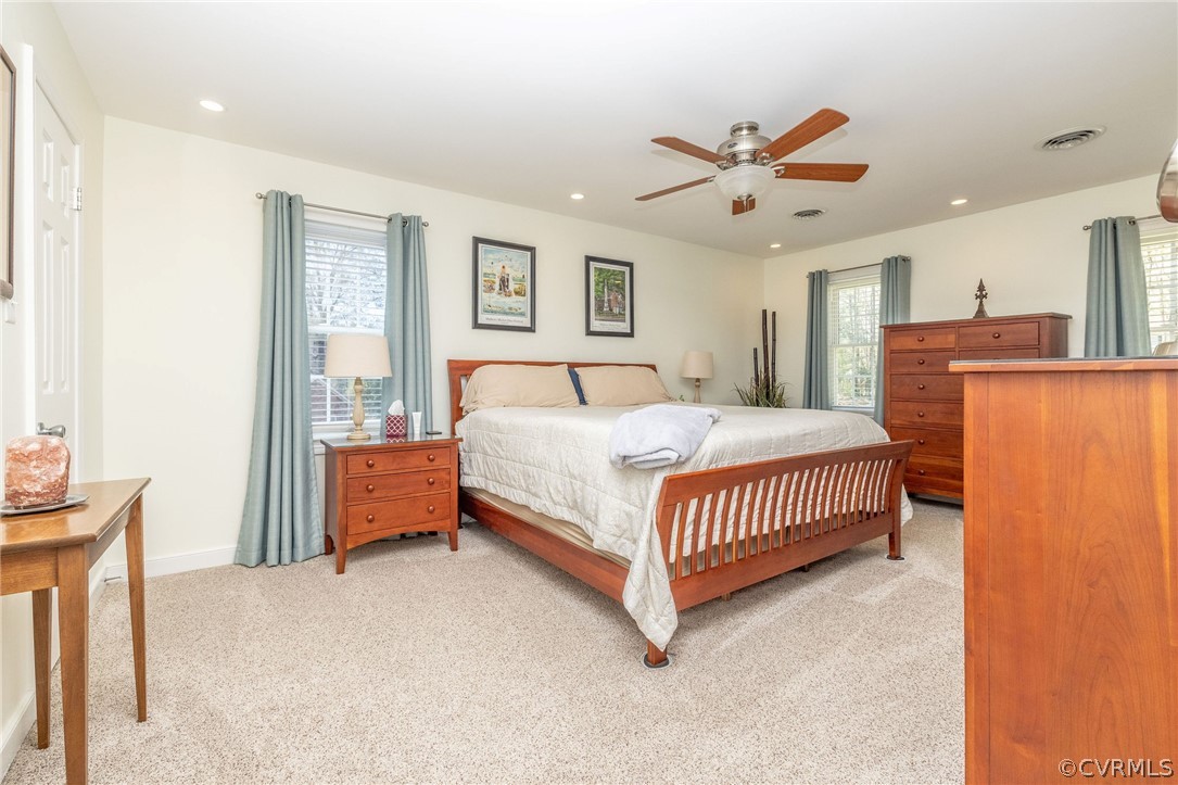 13331 Queensgate Road Midlothian, VA 23114 - Photo 34 of 46 a bedroom with a bed and a chandelier