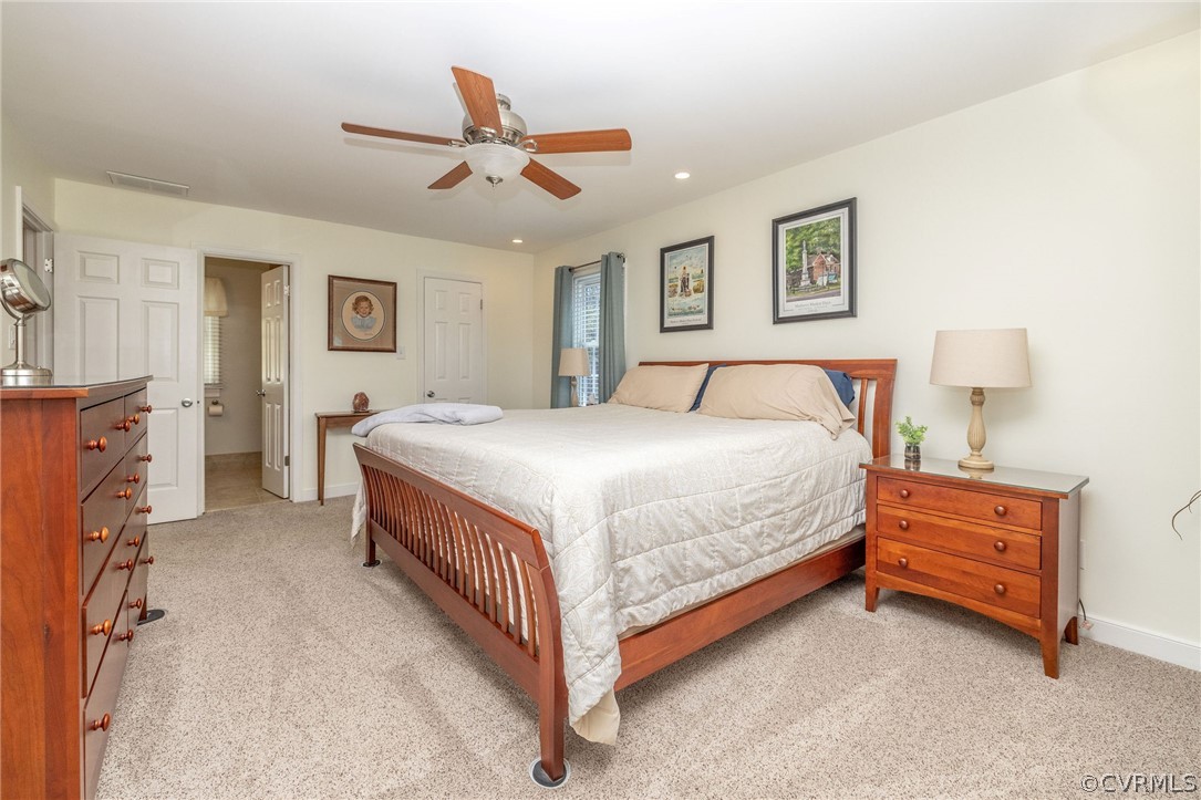 13331 Queensgate Road Midlothian, VA 23114 - Photo 35 of 46 a bedroom with a bed and a chandelier