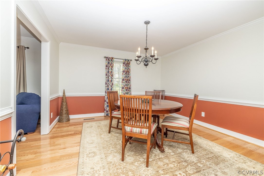 13331 Queensgate Road Midlothian, VA 23114 - Photo 8 of 46 a view of a dining room with furniture and chandelier