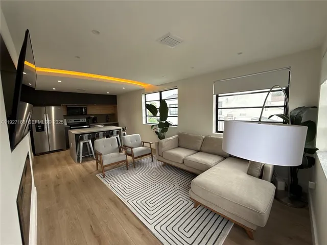a living room with furniture and a window