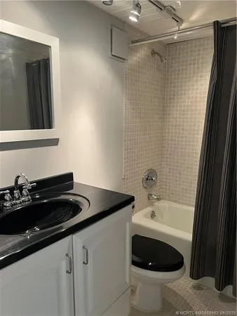 a bathroom with a sink and a bathtub
