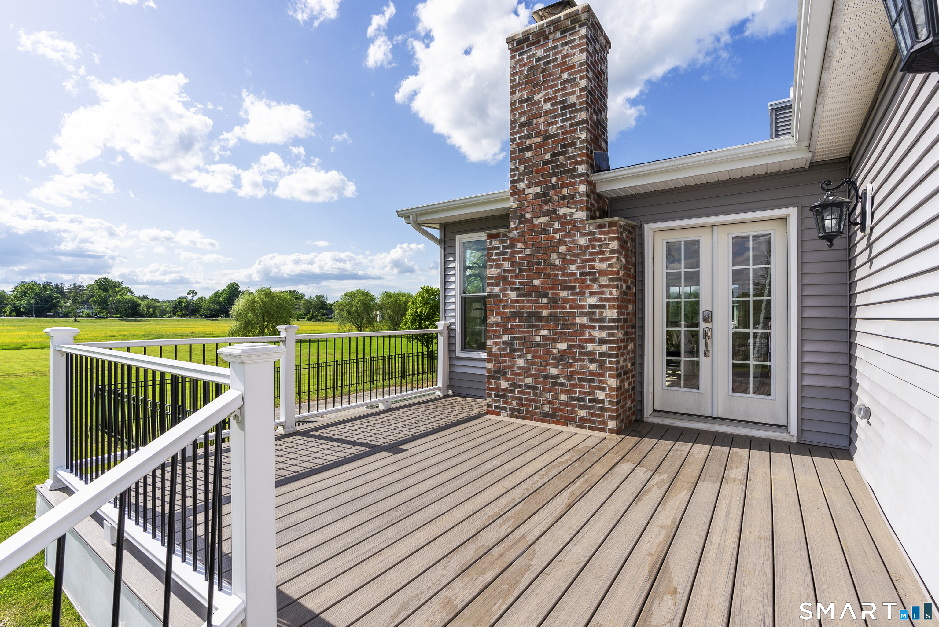 44 Farmstead Lane Suffield, CT 06078 - Photo 34 of 39 a view of a balcony with wooden floor and city view