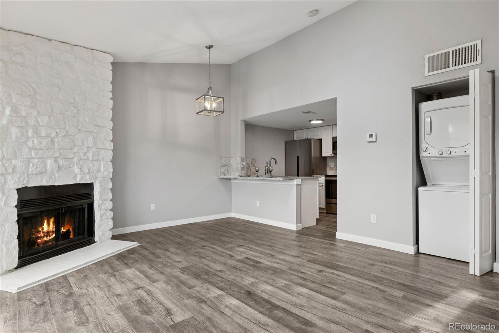 3100 South Federal Boulevard, Unit 331 Denver, CO 80236 - Photo 27 of 29 a view of an empty room and fire place