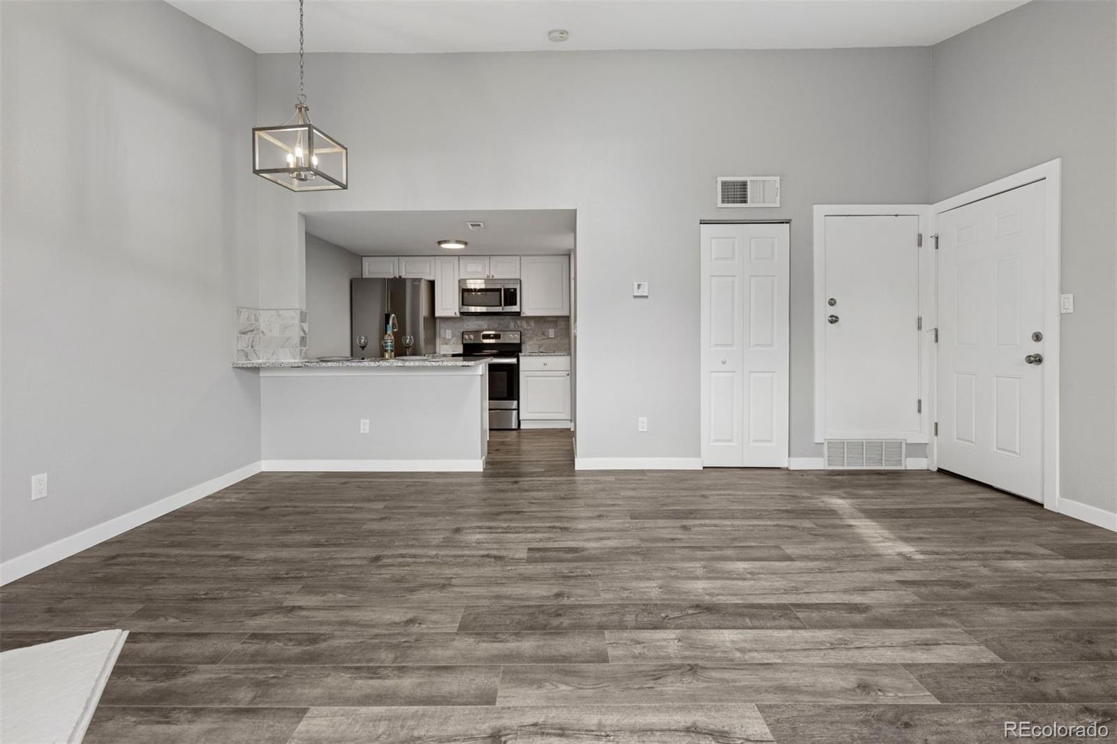 3100 South Federal Boulevard, Unit 331 Denver, CO 80236 - Photo 28 of 29 a view of a kitchen with microwave and cabinets