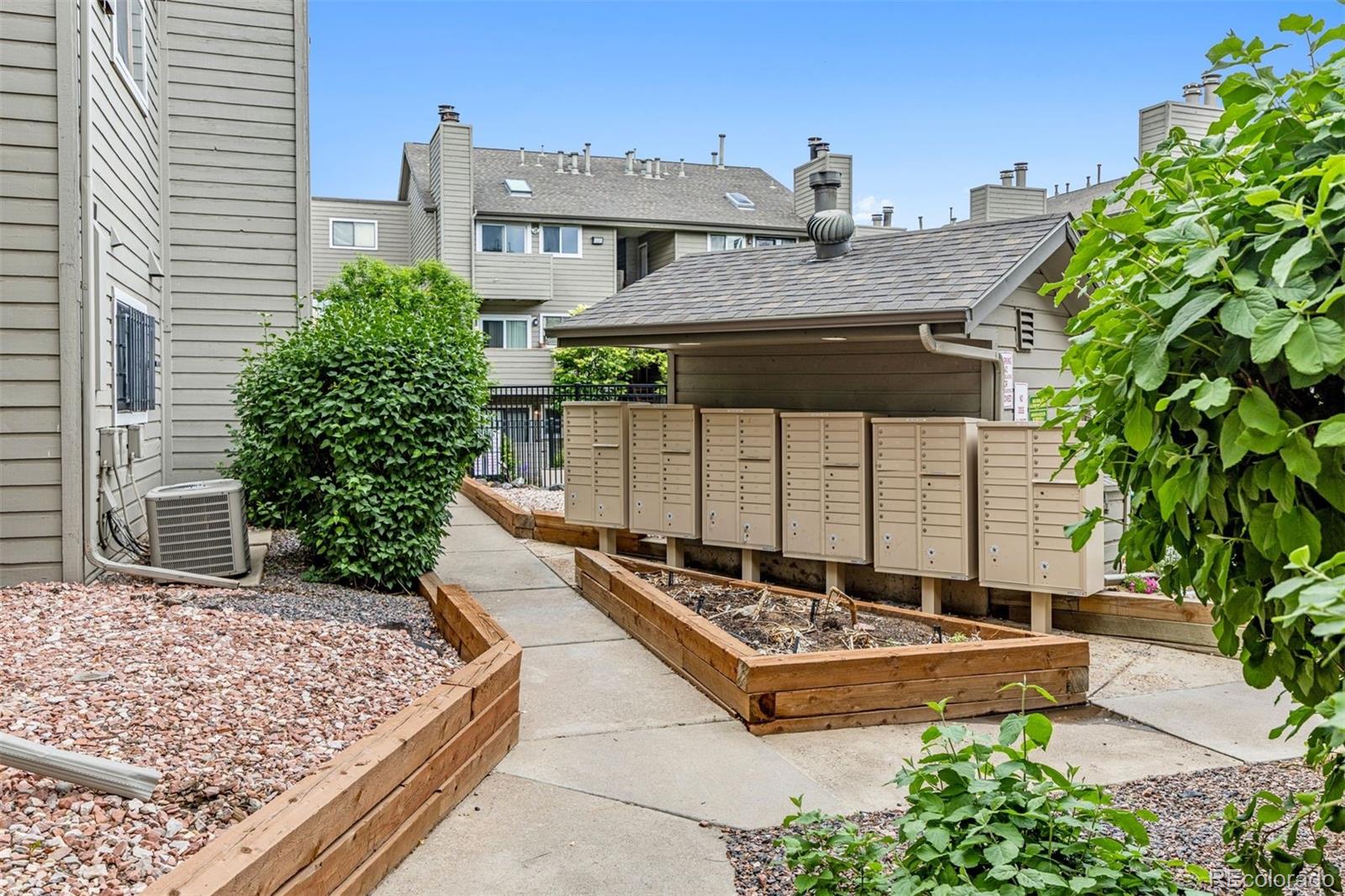 3100 South Federal Boulevard, Unit 331 Denver, CO 80236 - Photo 29 of 29 a front view of a house with a yard