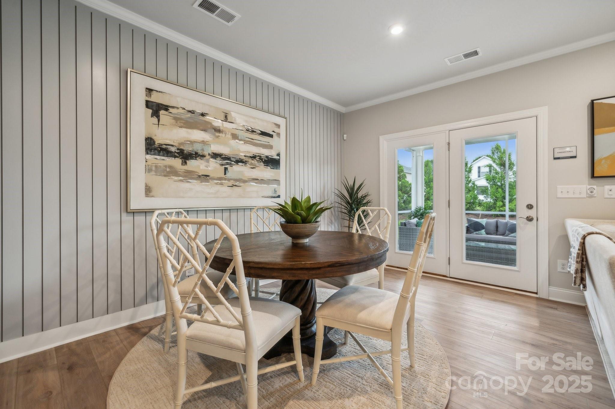 5119 Raging Crk Drive Indian Trail, NC 28079 - Photo 20 of 34 a view of a dining room with furniture and a potted plant