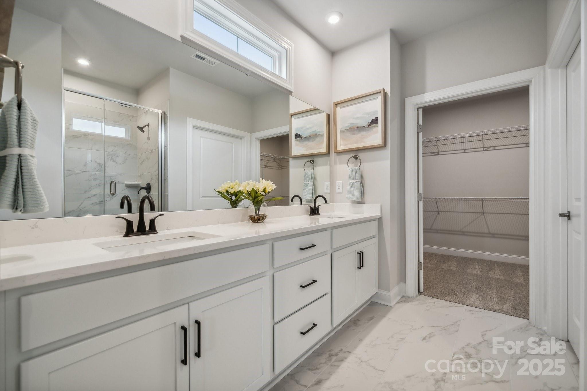 5119 Raging Crk Drive Indian Trail, NC 28079 - Photo 4 of 34 a spacious bathroom with double sink and a shower