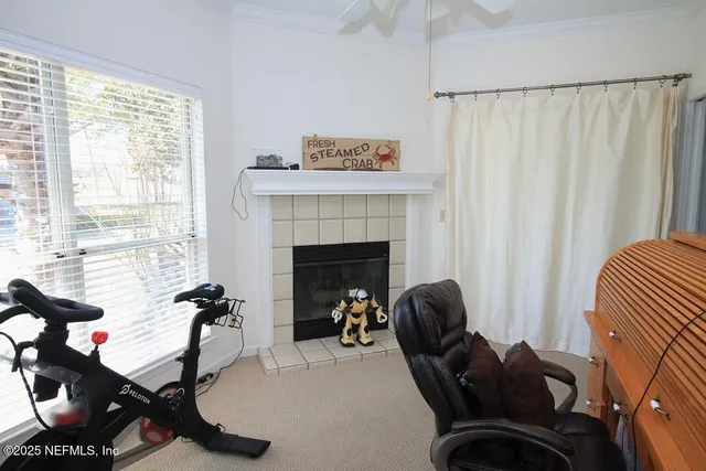 a view of a livingroom with furniture and windows