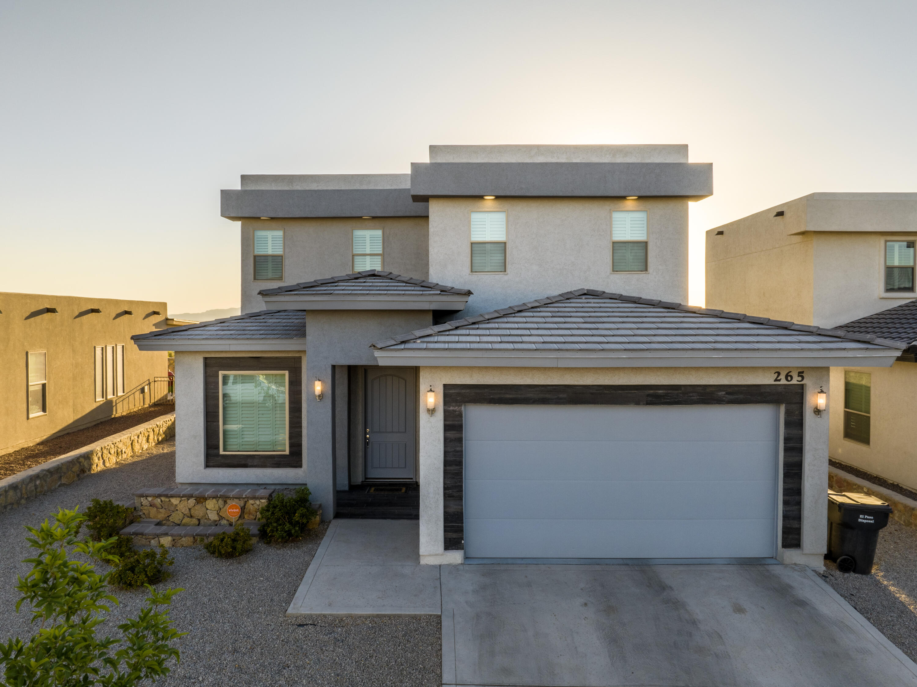 265 Ulshaw Street El Paso, TX 79928 - Photo 1 of 1 a front view of a house with garage