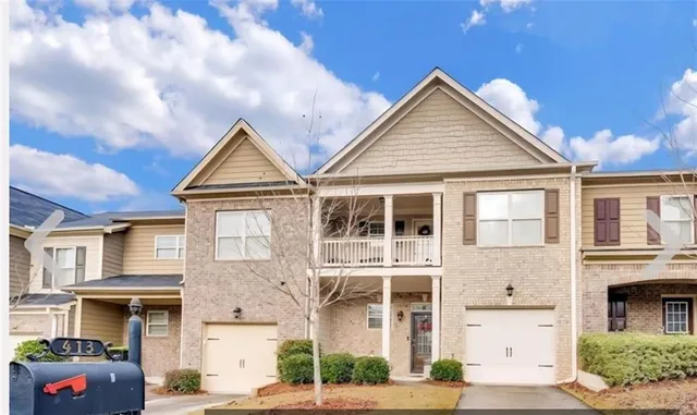 a view of a big house with many windows