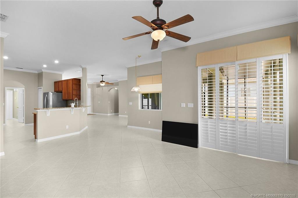 439 Northwest Sunflower Place Stuart, FL 34994 - Photo 13 of 68 a view of kitchen with furniture and a large window