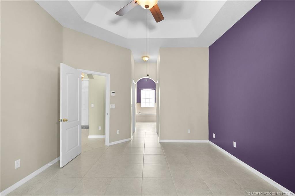 439 Northwest Sunflower Place Stuart, FL 34994 - Photo 25 of 68 wooden floor in an empty room with a window