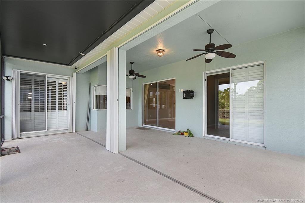 439 Northwest Sunflower Place Stuart, FL 34994 - Photo 30 of 68 a view of a livingroom with furniture and windows
