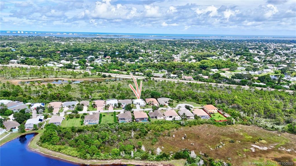 439 Northwest Sunflower Place Stuart, FL 34994 - Photo 45 of 68 a view of a lake with a city