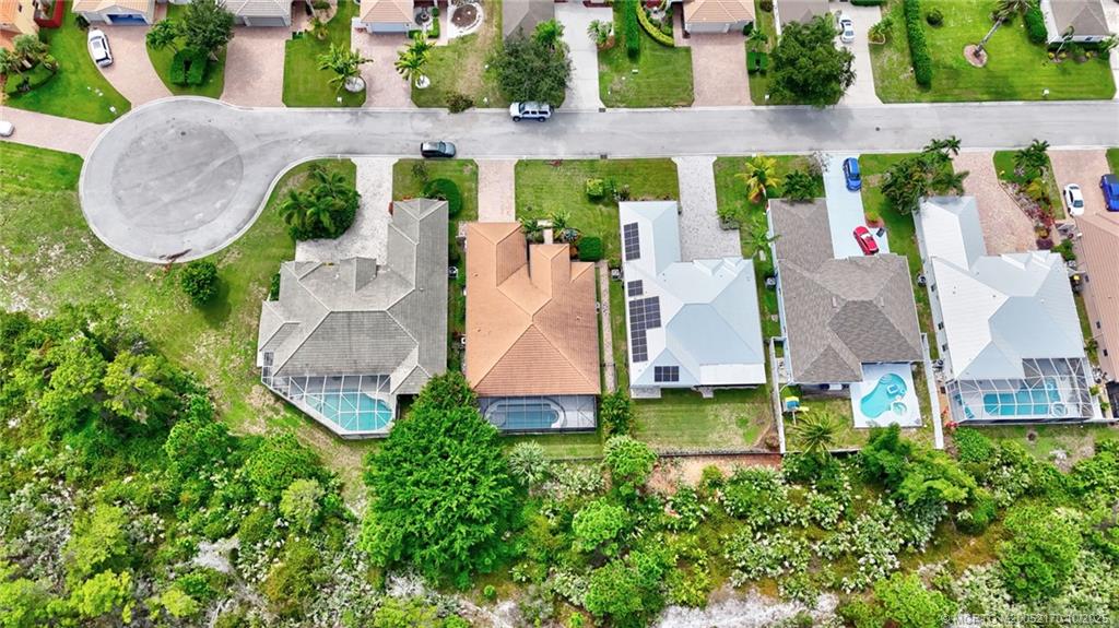 439 Northwest Sunflower Place Stuart, FL 34994 - Photo 65 of 68 an aerial view of a house with a swimming pool