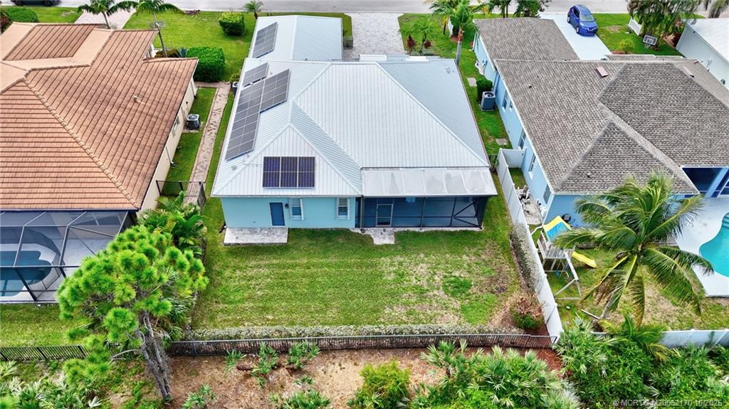 439 Northwest Sunflower Place Stuart, FL 34994 - Photo 67 of 68 an aerial view of a house with a yard
