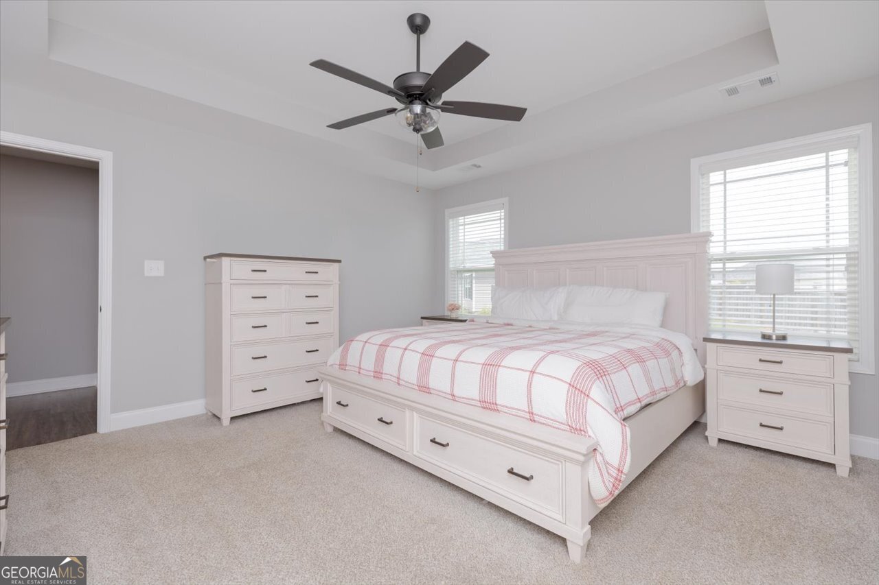104 Meredith Layne Court Perry, GA 31069 - Photo 23 of 46 a bedroom with a bed and window