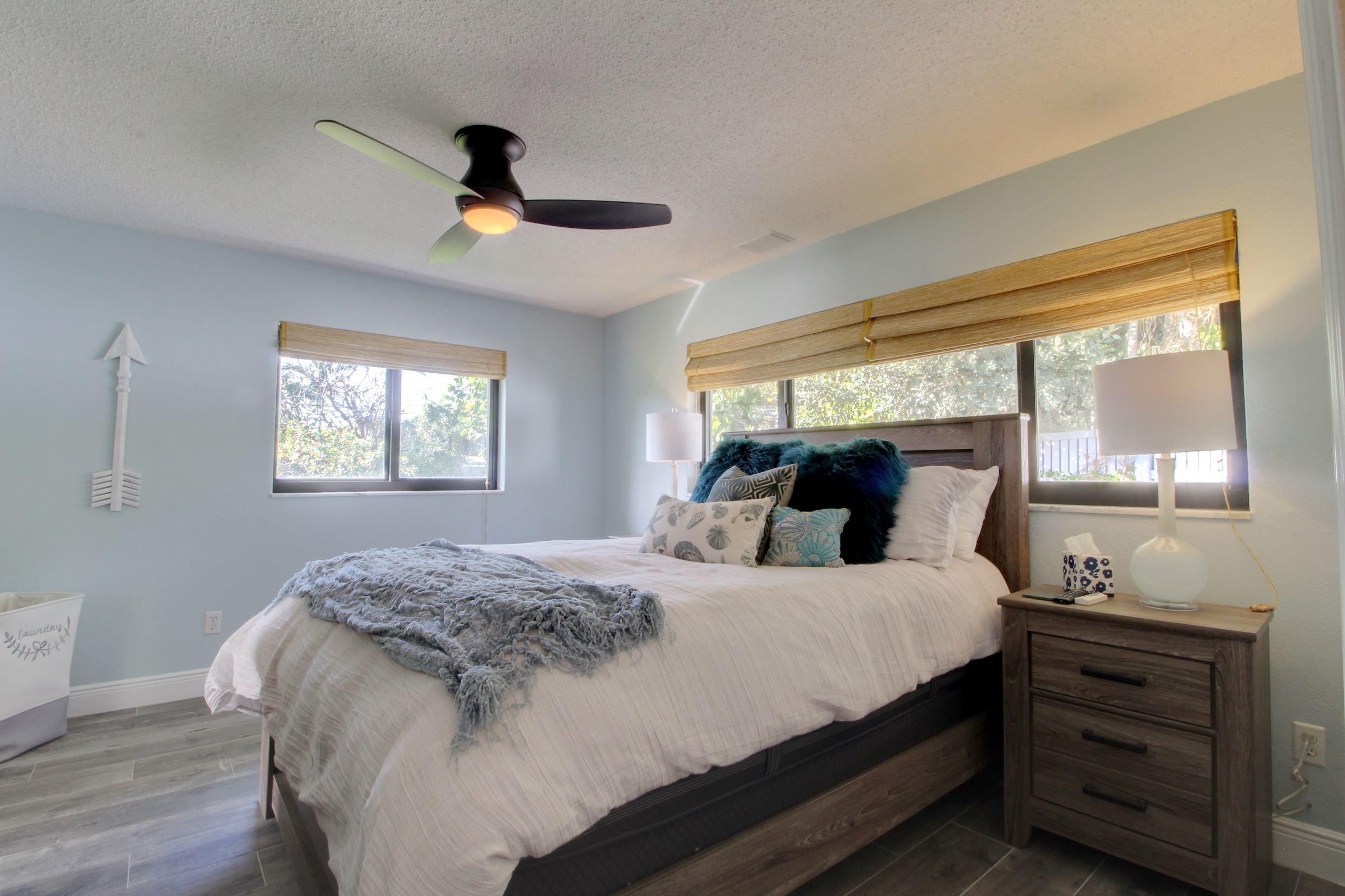1501 Banyan Road Boca Raton, FL 33432 - Photo 18 of 26 a bedroom with a bed and a dresser in it