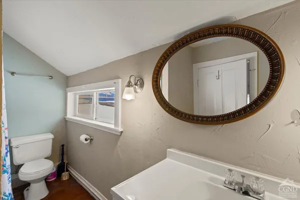 a bathroom with a toilet and a sink