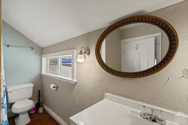 a bathroom with a toilet and a sink