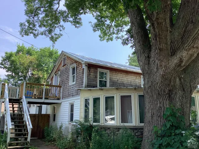 aerial view of a house with a tree