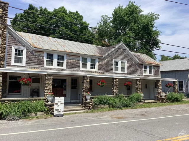 front view of a house with a garden