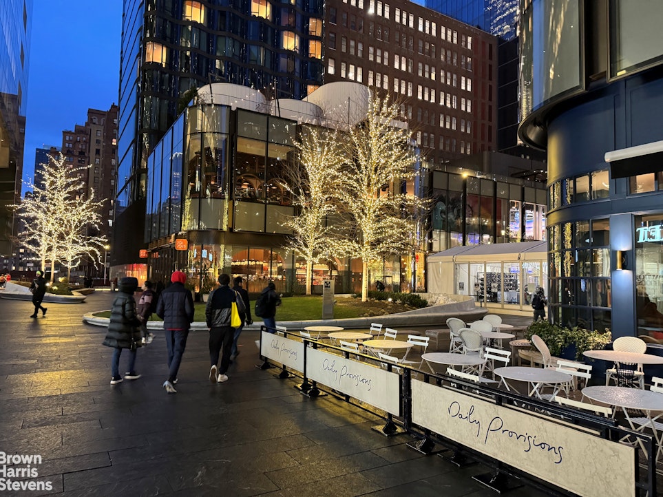 433 West 34th Street, Unit 5M Manhattan, NY 10001 - Photo 12 of 13 a city street filled with lots of tall buildings