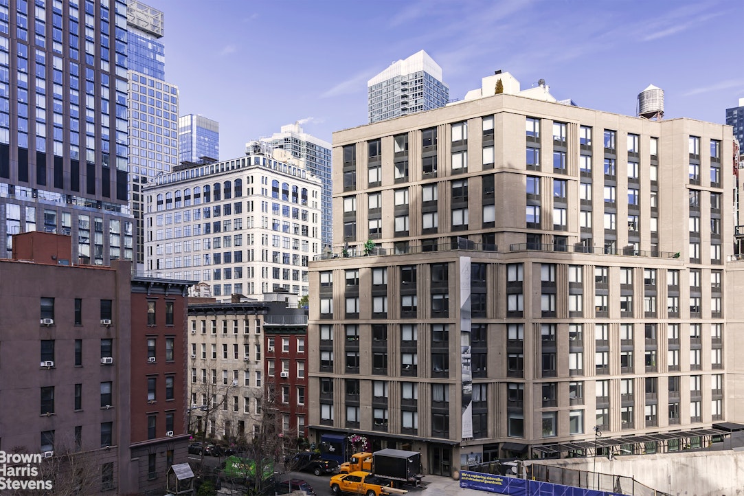 433 West 34th Street, Unit 5M Manhattan, NY 10001 - Photo 3 of 13 a view of a building with a street