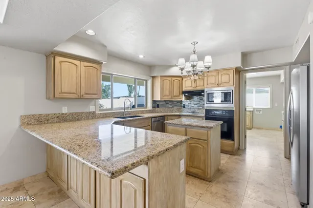 an empty room with a empty space and a ceiling fan