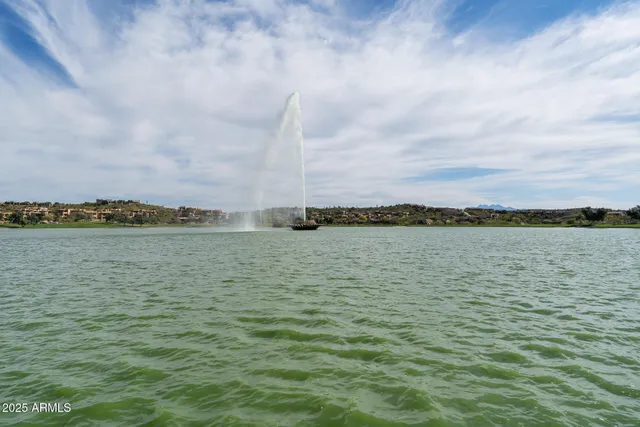 a view of a dining room with furniture and window