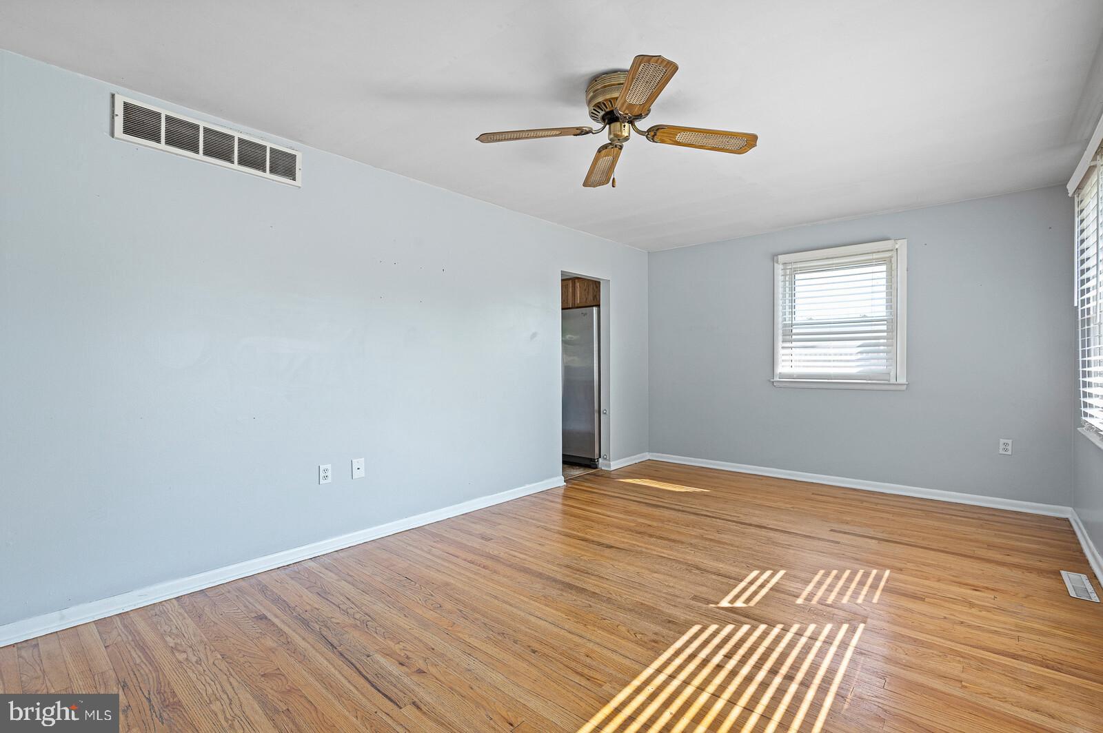 212 North Brownleaf Road Newark, DE 19713 - Photo 2 of 10 a view of empty room with wooden floor and fan