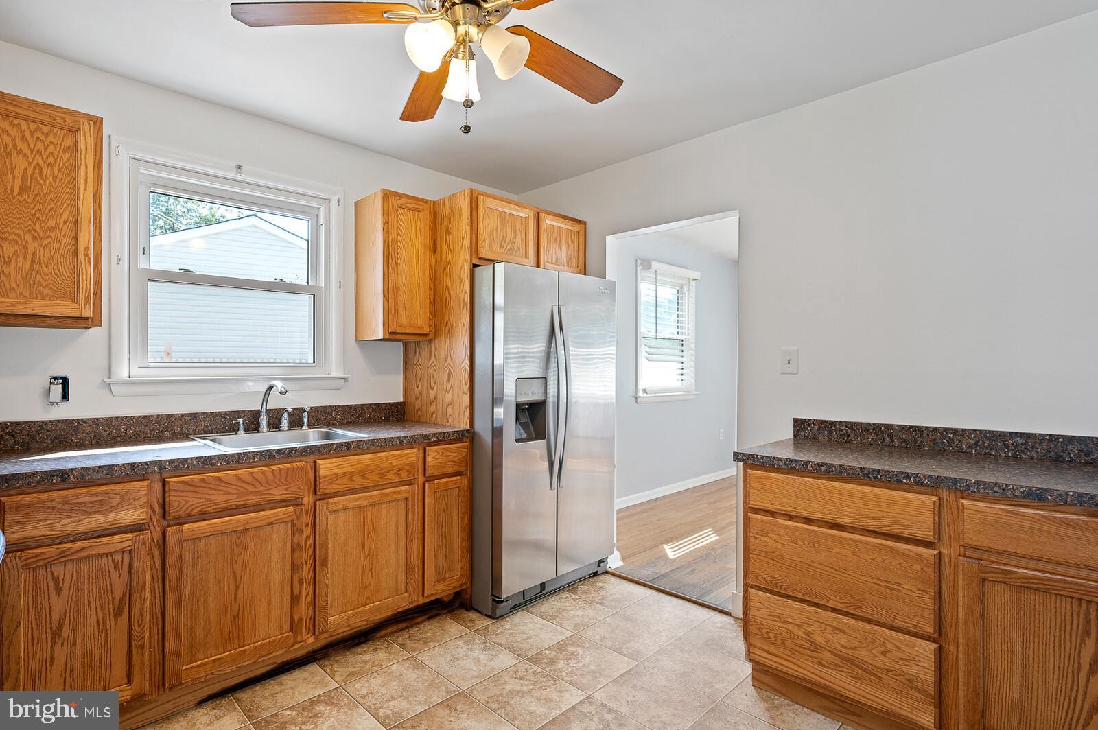 212 North Brownleaf Road Newark, DE 19713 - Photo 8 of 10 a kitchen with stainless steel appliances granite countertop cabinets and window