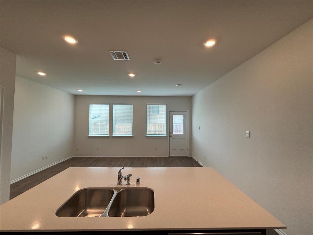 6114 Holly Spg Road Princeton, TX 75407 - Photo 3 of 7 a bathroom with a sink and a window