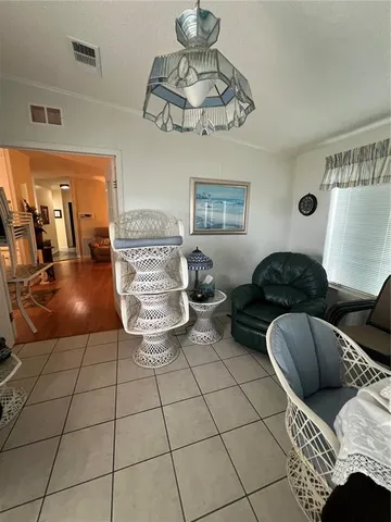 a kitchen with a refrigerator and a stove top oven