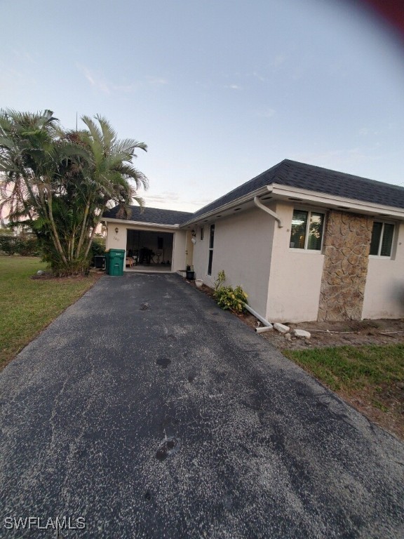 a front view of house with yard and trees