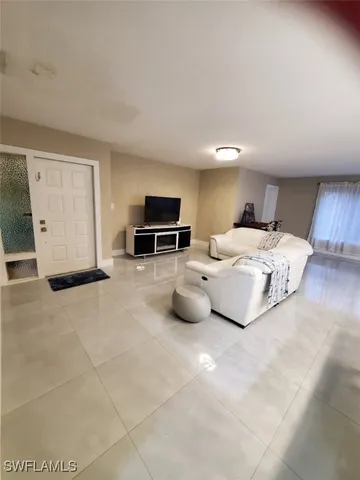 a bedroom with bed and window