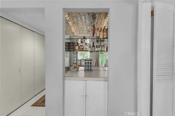 a kitchen with a refrigerator and a window
