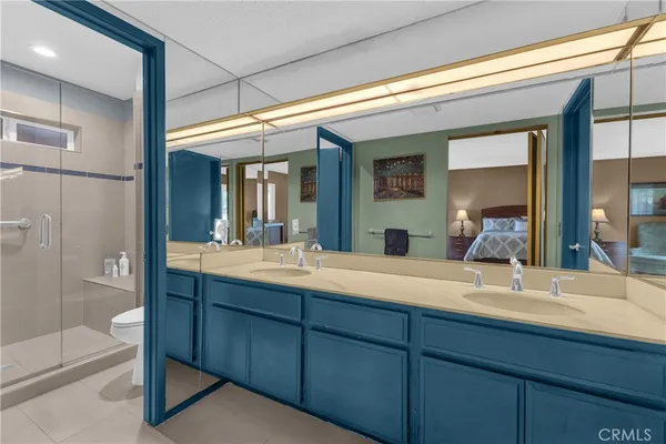 a bathroom with a shower and a mirror