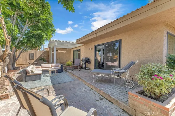 a outdoor space with patio the couches and a potted plant on a table