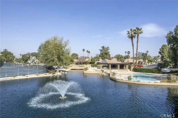 a view of a swimming pool with a patio