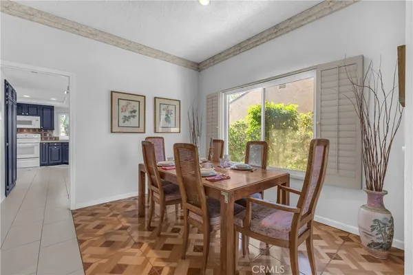 a dining room with furniture and window